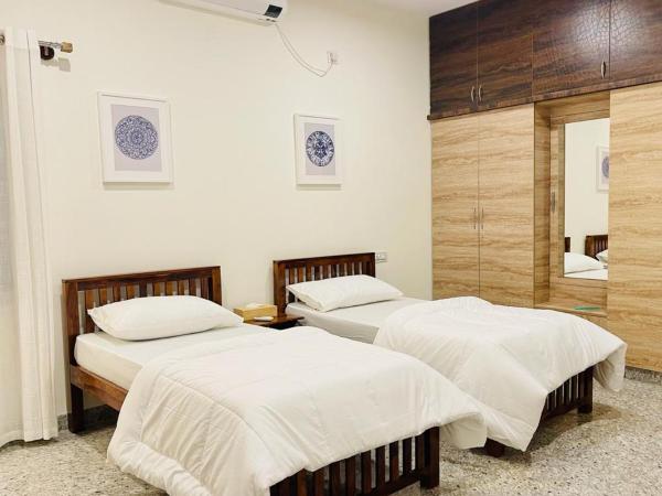 Vasudha : photo 8 de la chambre chambre double ou lits jumeaux avec salle de bains privative