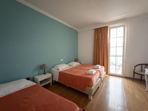 City Marina : photo 9 de la chambre chambre triple supérieure avec lit d'appoint