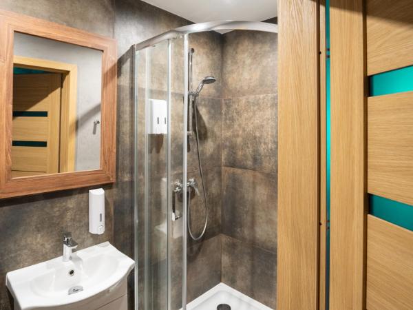 Centrum Szkoleniowo-Konferencyjne : photo 4 de la chambre chambre double ou lits jumeaux - vue sur jardin