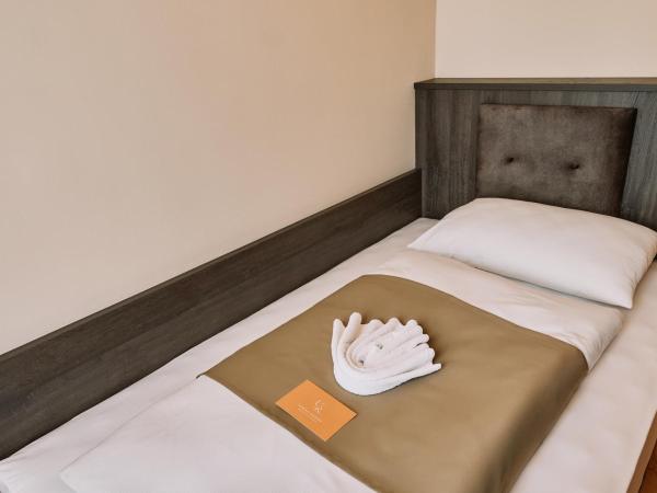 Urban Rooms Rathaus - Self Check-In : photo 2 de la chambre chambre simple supérieure