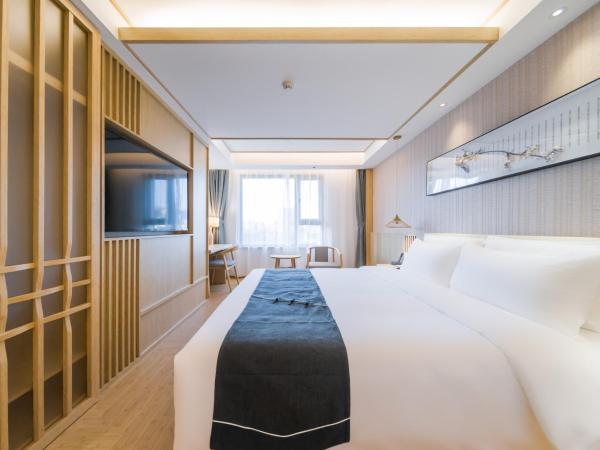 Jianguo Puyin Hotel - Xi'an Big Wild Goose Pagoda University of Science and Technology Qujiang Campus Metro Station : photo 1 de la chambre chambre lit king-size deluxe