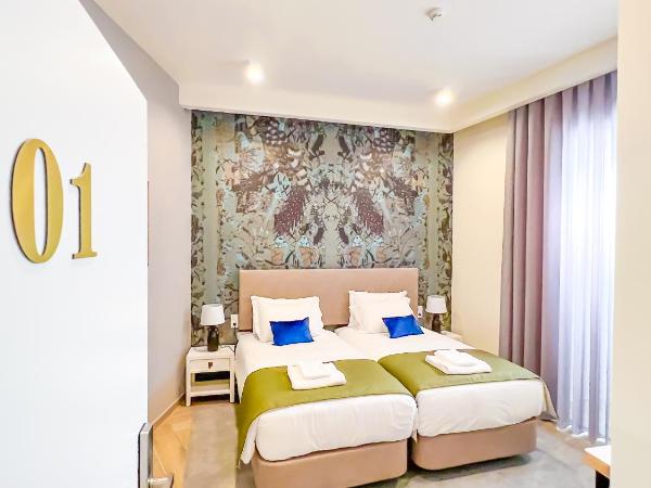 Guest House Jacarandá Faro : photo 8 de la chambre chambre lits jumeaux