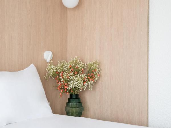 Novotel Macon Nord Autoroute du Soleil : photo 9 de la chambre chambre double supérieure avec canapé