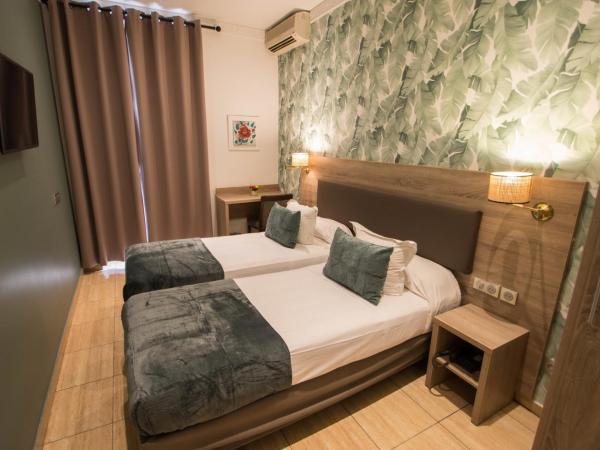 Hôtel Parisien : photo 5 de la chambre chambre lits jumeaux