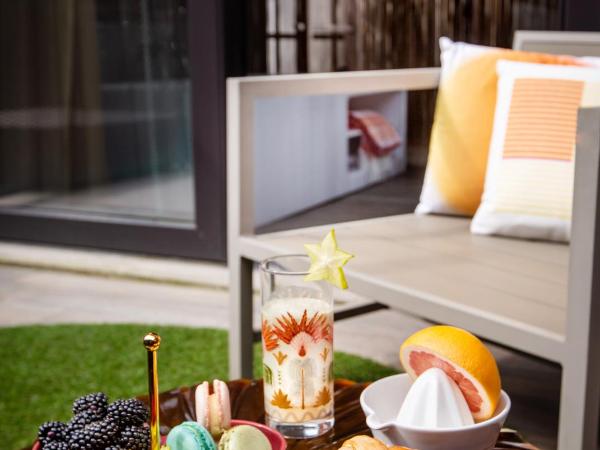 Milan Suite Hotel : photo 2 de la chambre suite junior avec jardin privé