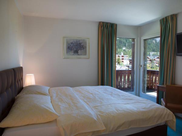 Hotel Helvetia Intergolf : photo 2 de la chambre chambre triple exécutive avec balcon - vue sur montagnes