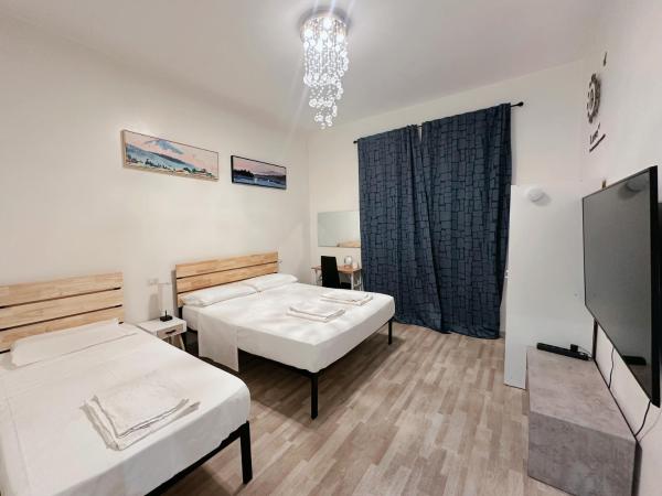 BED & BREAKFAST SAKURA : photo 7 de la chambre chambre triple avec salle de bains commune