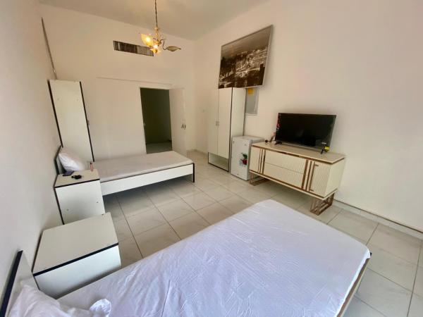 Comfortable Private Rooms in Compound Housing : photo 4 de la chambre chambre lits jumeaux