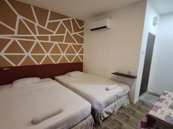Maleeq Hotel @ Meru Ipoh : photo 1 de la chambre chambre deluxe double ou lits jumeaux