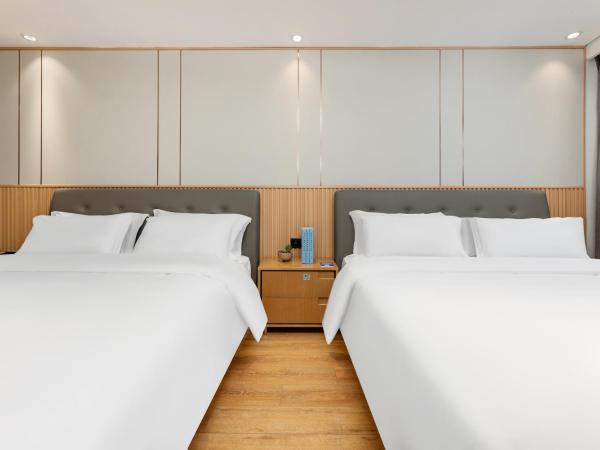 Waito Hotel Yuexiu Park Guangzhou : photo 2 de la chambre chambre familiale supérieure