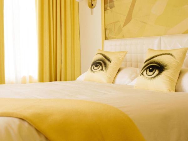 Angad Arts Hotel : photo 1 de la chambre chambre lit queen-size 