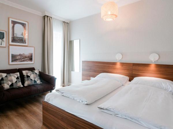 Hotel Villa Solln : photo 10 de la chambre chambre double standard avec canapé