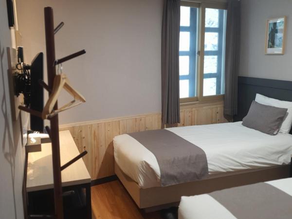 Ehwa In Myeongdong : photo 5 de la chambre chambre lits jumeaux