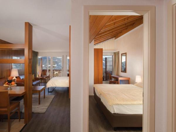 Hotel Helvetia Intergolf : photo 1 de la chambre chambre quadruple exécutive avec balcon - vue sur montagnes