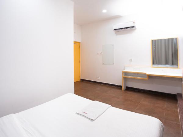 Stayz Inn Mylapore near light house : photo 1 de la chambre chambre deluxe double ou lits jumeaux
