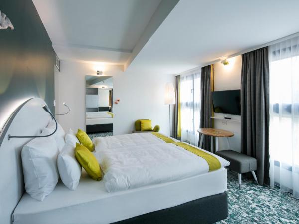 ARCOTEL Donauzentrum Wien : photo 9 de la chambre chambre lit king-size