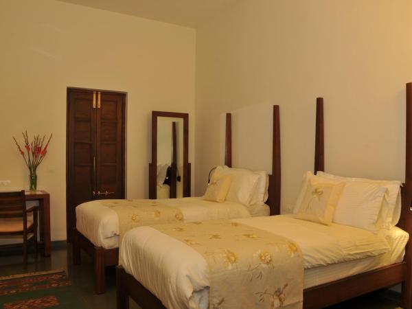 Uteliaa Manor Garden Retreat : photo 1 de la chambre chambre lits jumeaux spacieuse