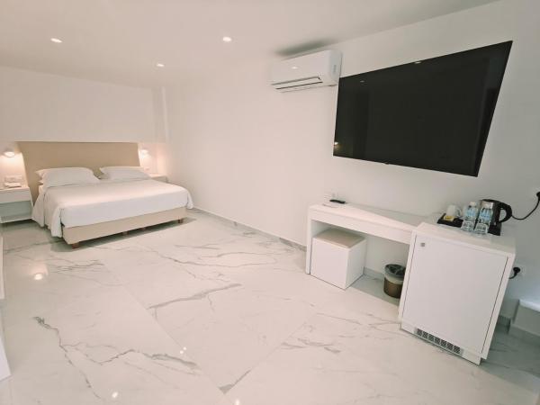 Ibiscus Hotel : photo 3 de la chambre chambre triple - vue sur jardin