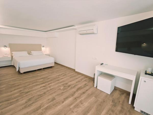 Ibiscus Hotel : photo 9 de la chambre chambre triple - vue sur jardin