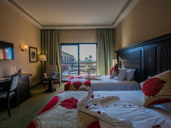 DWO Marrakech Ennakhil : photo 6 de la chambre chambre double ou lits jumeaux supérieure - vue sur jardin