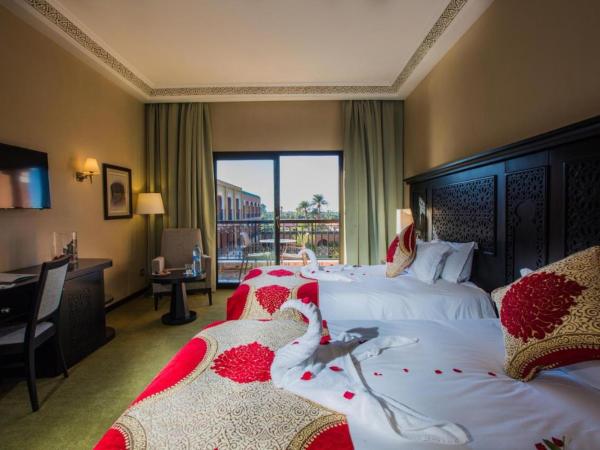 DWO Marrakech Ennakhil : photo 4 de la chambre chambre double ou lits jumeaux supérieure - vue sur jardin