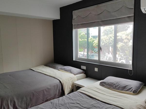 Suzhou Blue Gate Youth Hostel : photo 1 de la chambre chambre familiale avec salle de bains privative