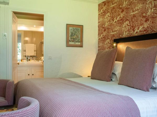 Les Manoirs de Tourgéville : photo 1 de la chambre chambre double - vue sur jardin