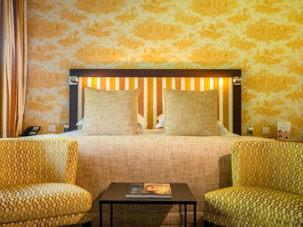 Les Manoirs de Tourgéville : photo 5 de la chambre chambre double - vue sur jardin