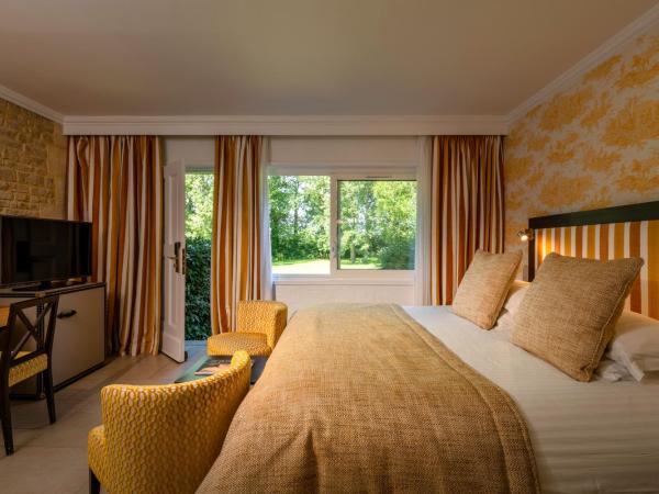 Les Manoirs de Tourgéville : photo 7 de la chambre chambre double - vue sur jardin