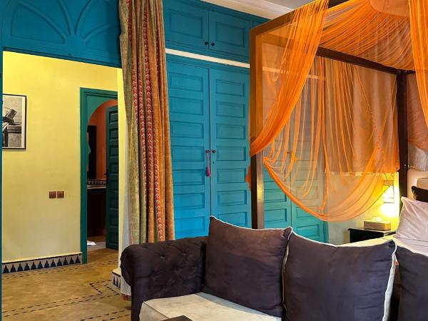 Palais Riad Berbère : photo 5 de la chambre portes coulissantes dans la suite familiale deluxe.
