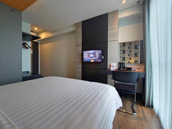 Luminor Hotel Jemursari By WH : photo 4 de la chambre chambre deluxe double ou lits jumeaux