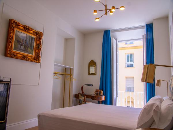 Pries Homes La Casa Azul : photo 1 de la chambre chambre lit queen-size avec balcon