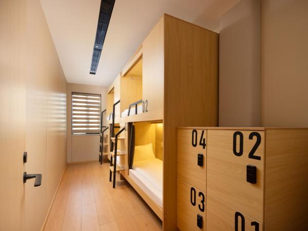 Shanghai Captain 5 Youth Hotel - Xinzhuang Metro Station : photo 1 de la chambre bed in 4-bed male dormitory room - shared bathroom