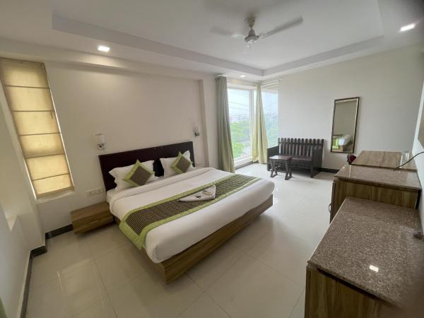 Pacific Inn Green, Gurgaon : photo 1 de la chambre chambre lit king-size
