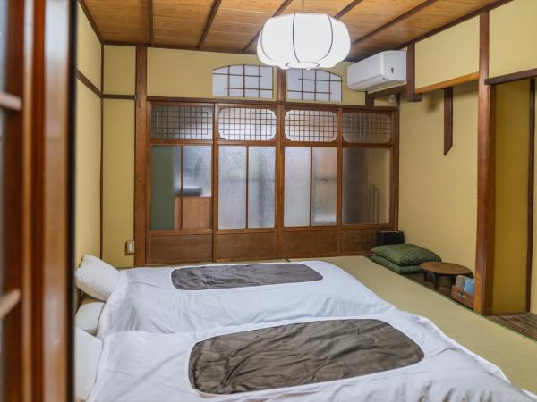 Guest House Hitsujian : photo 4 de la chambre chambre lits jumeaux - vue sur jardin