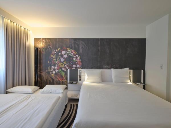 Novotel München City : photo 5 de la chambre chambre double standard avec canapé