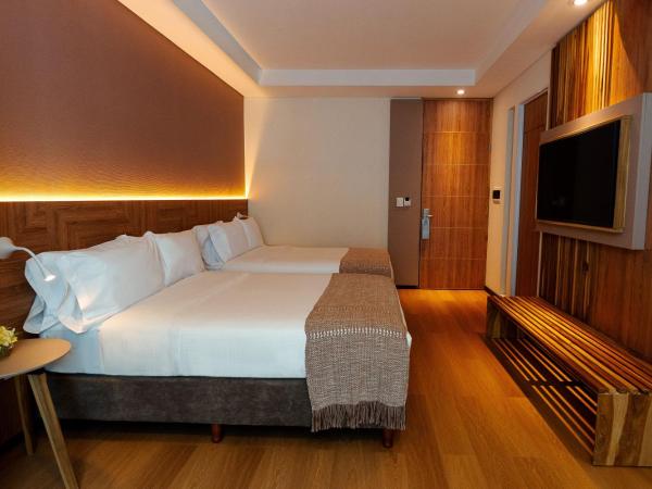 Brizo Salta : photo 1 de la chambre chambre double supérieure avec deux lits doubles