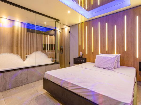 EUPHORIA MOTEL : photo 4 de la chambre suite deluxe avec baignoire spa