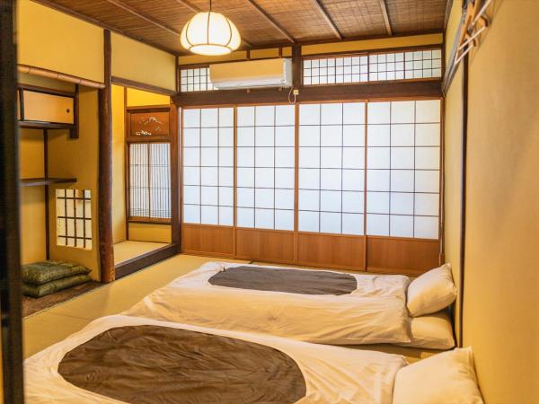 Guest House Hitsujian : photo 1 de la chambre chambre lits jumeaux avec balcon