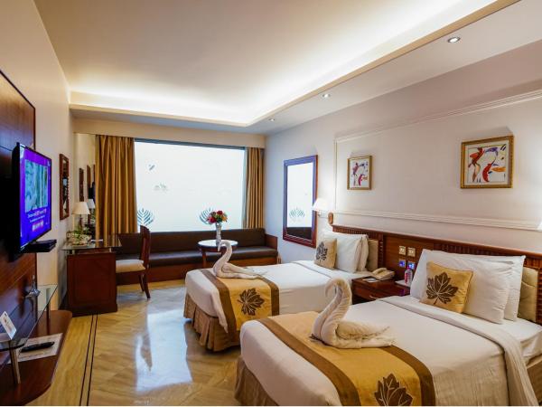 Clarion Bella Casa at Airport : photo 1 de la chambre chambre double ou lits jumeaux club