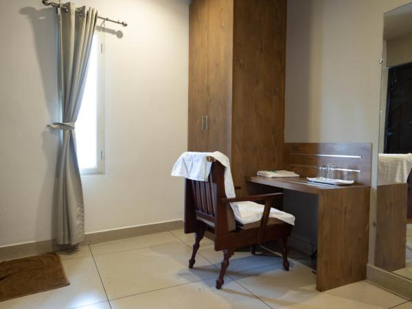 Aryaas Residency Nettoor : photo 1 de la chambre suite