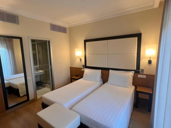 Hotel Daniel & Ristorante Cocchi : photo 1 de la chambre chambre lits jumeaux
