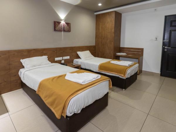 Aryaas Residency Nettoor : photo 6 de la chambre chambre double