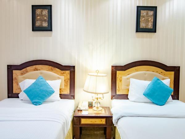 Garden Hotel Muscat By Royal Titan Group : photo 1 de la chambre chambre lits jumeaux