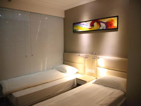 Shanghai Fish Inn East Nanjing Road : photo 2 de la chambre chambre lits jumeaux deluxe