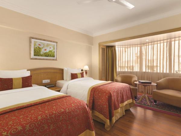 Ramada Plaza By Wyndham Palm Grove : photo 1 de la chambre chambre deluxe