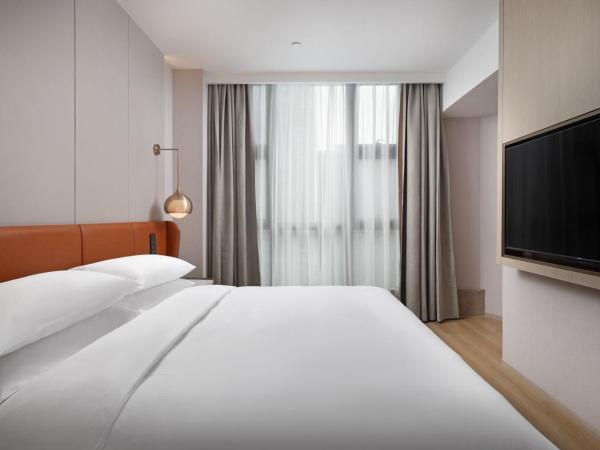 Home2 Suite by Hilton Wuhan Economic Development Zone : photo 4 de la chambre suite
