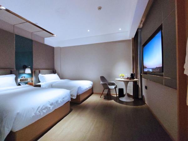 Paco Hotel Guangzhou South Railway Station Panyu Changlong Branch : photo 2 de la chambre chambre double