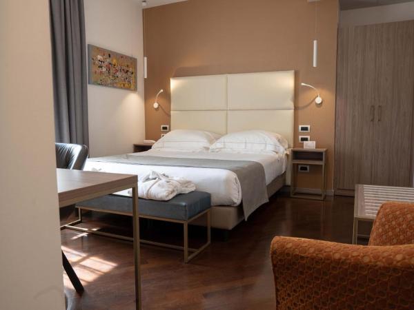 Le Cappuccinelle Suites&SPA : photo 2 de la chambre chambre lit king-size deluxe