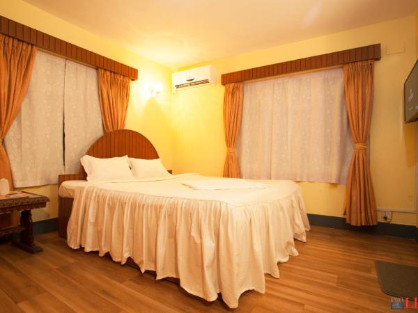 Hotel Melungtse & Apartmentent : photo 1 de la chambre chambre lits jumeaux